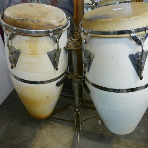 321 - A pair of percussion drums on stand