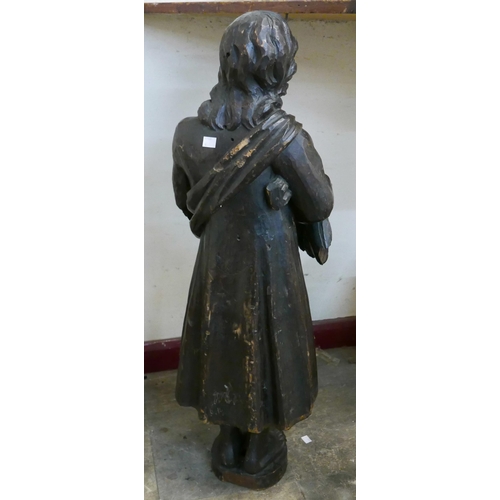 325 - A 19th Century continental carved softwood figure of a lady