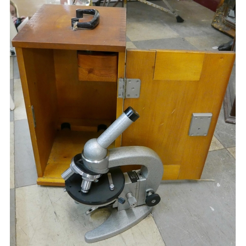 329 - A vintage cased microscope