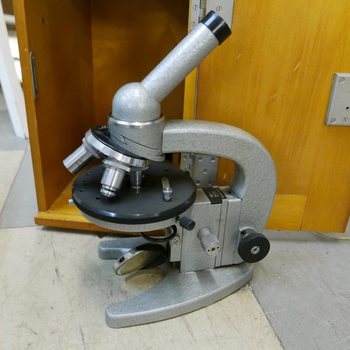 329 - A vintage cased microscope