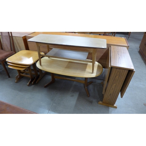 38 - A simulated rosewood drop leaf table and a coffee table and a teak nest of tables and coffee table