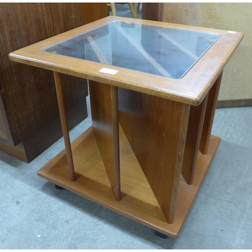 47 - A teak and glass topped coffee table/record cabinet