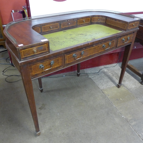 50 - A Regency style inlaid mahogany Carlton House desk