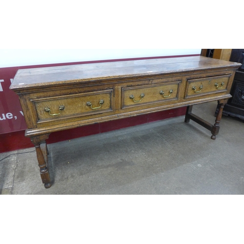 51 - A George II style oak three drawer Welsh dresser