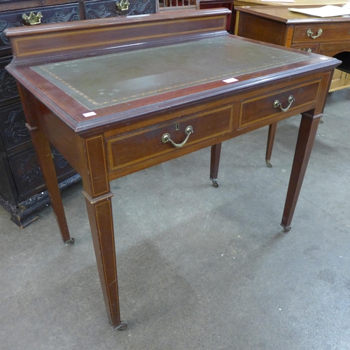 53 - An Edward VII inlaid mahogany and green leather topped two drawer writing table