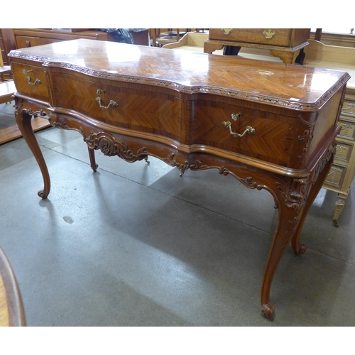 62 - A French kingwood three drawer serpentine serving table