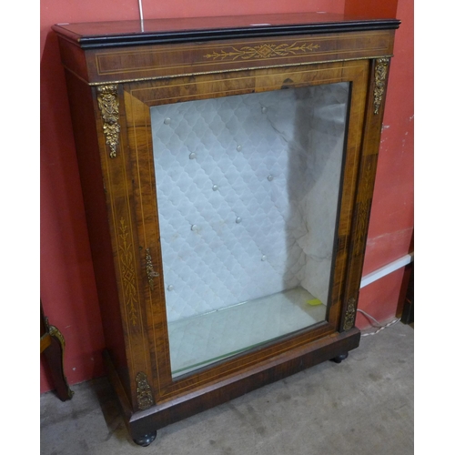 72 - A Victorian figured walnut and gilt metal mounted pier cabinet