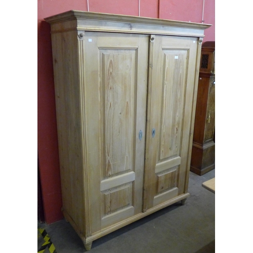 75 - A 19th Century style French pine two door armoire