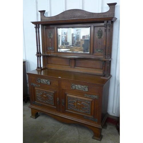 79 - An Arts and Crafts oak mirrorback sideboard