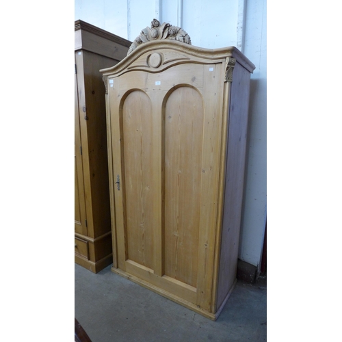 82 - A 19th Century style French pine single door armoire