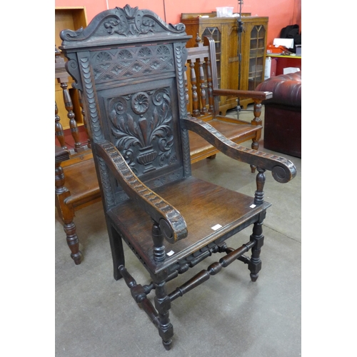 83 - A 17th Century style carved oak Wainscott chair