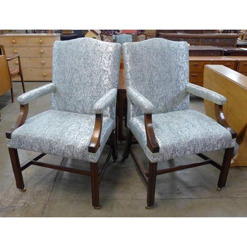 85 - A pair of George III style mahogany and fabric upholstered Gainsborough chairs