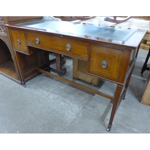 98 - An Edward VII inlaid mahogany and green leather topped three drawer writing table