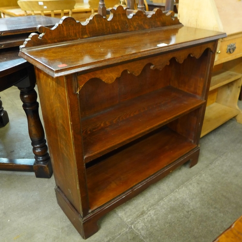 99 - An Edward VII oak student's bureau and an open bookcase