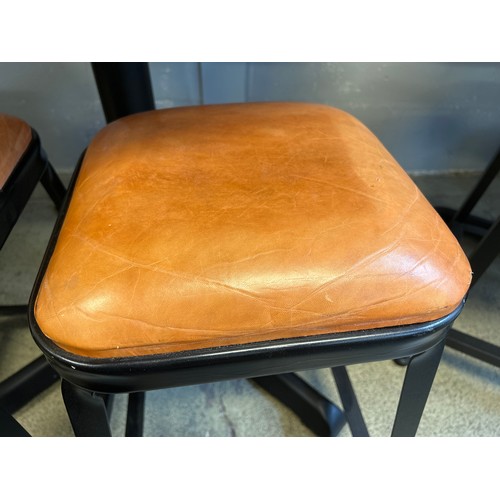 1635 - A black granite circular pub table and four industrial style stools