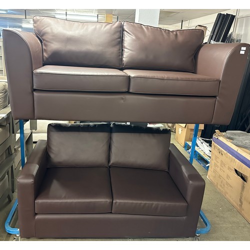 1602 - A pair of chocolate leather effect 3+2 seater sofas (damaged)