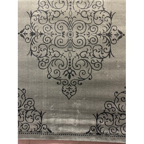 1588 - A grey and black full pile designer rug (230cm x 160cm(