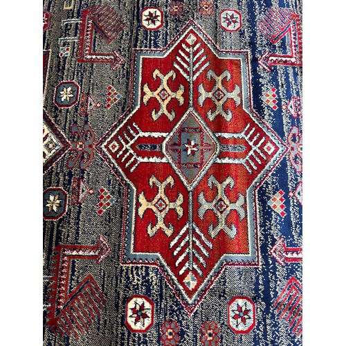 1583 - A blue ground full pile Cashmere rug with Aztek design (170cm x 120cm)