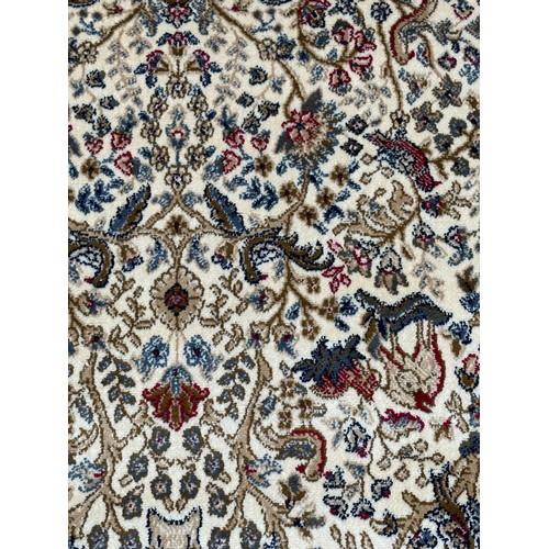 1585 - An ivory ground cashmere rug, full pile with tree of life design (170cm x 120cm)