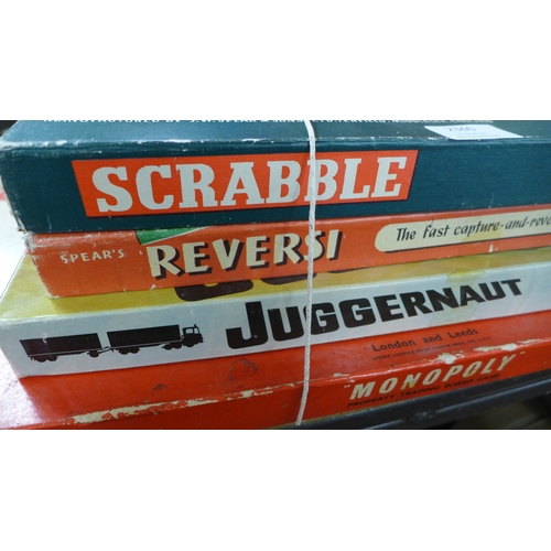 2346 - Four vintage bored games and two packs of cards including scrabble, reversi, juggernaut and monopoly