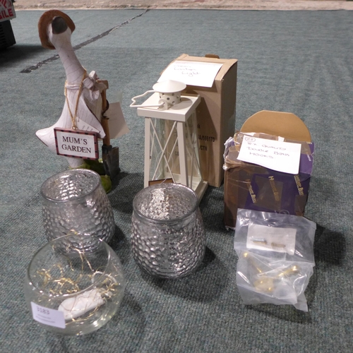 3183 - Quantity of misc. household items inc: wooden duck figure, tealight holders, brass hooks & a lantern... 