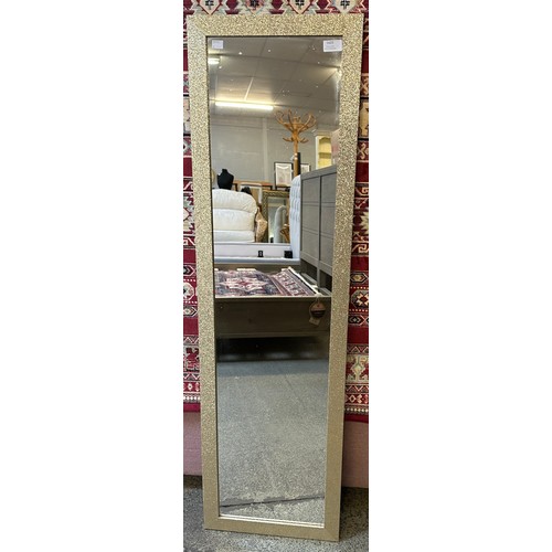 1609 - A gold glitter framed mirror (126.5cm x 36.5cm)