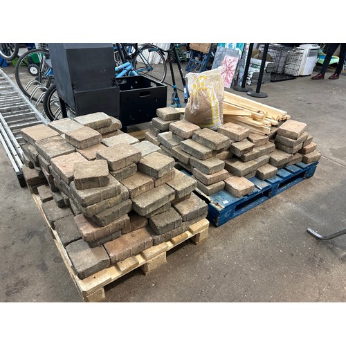 2232 - Two pallets of paving blocks including bag of sand and timber