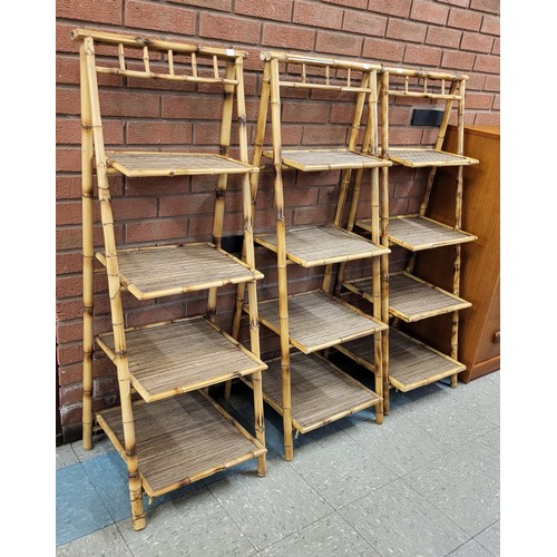 14 - A set of three bamboo and rattan four tier folding whatnots