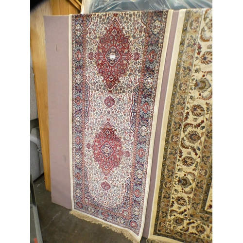 1502 - An ivory ground full pile cashmere runner with floral medallion design (300cm x 80cm)