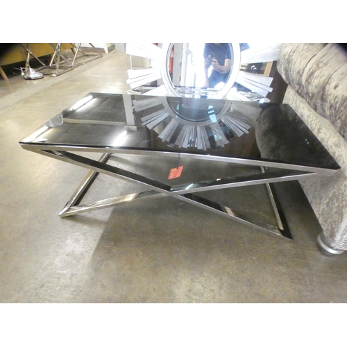 1504 - A black glass and chrome coffee table * this lot is subject to VAT