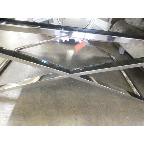 1504 - A black glass and chrome coffee table * this lot is subject to VAT