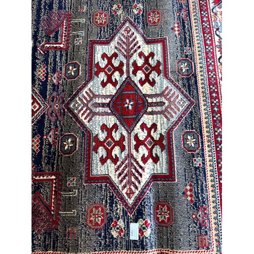 1459 - A blue ground full pile Cashmere rug with Aztec design (170cm x 120cm)