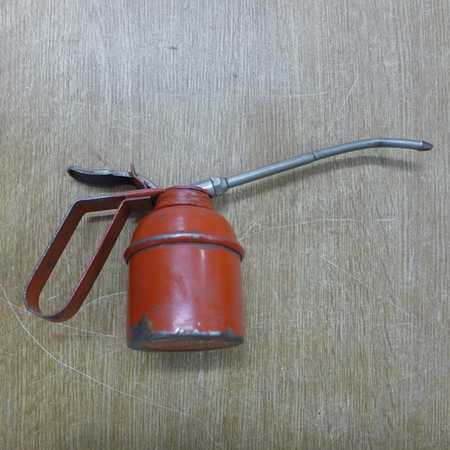 2027 - Two vintage oil cans and a petrol filter funnel