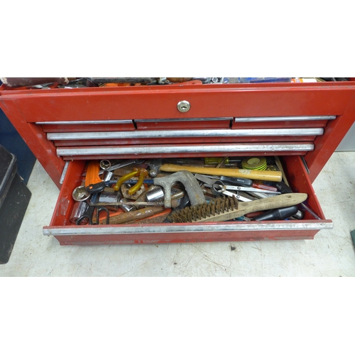 2032 - A red metal toolbox with sliding drawers including a quantity of mixed tools including sockets, scre... 