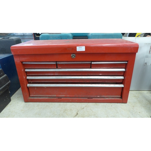 2032 - A red metal toolbox with sliding drawers including a quantity of mixed tools including sockets, scre... 