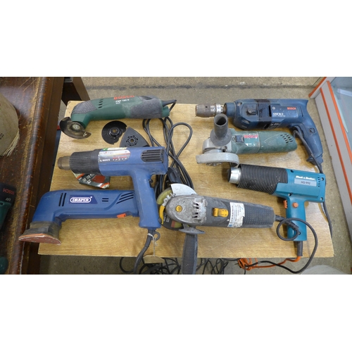 2051 - A quantity of power tools including Bosch PMF180E multi tool, Bosch grinder, Black & Decker heat gun... 