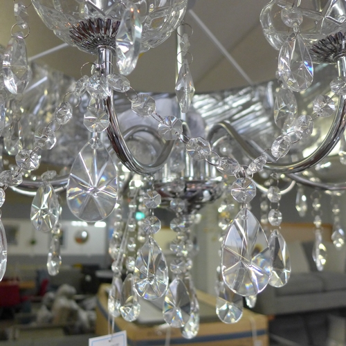 1308 - A chrome eight arm chandelier with black shade