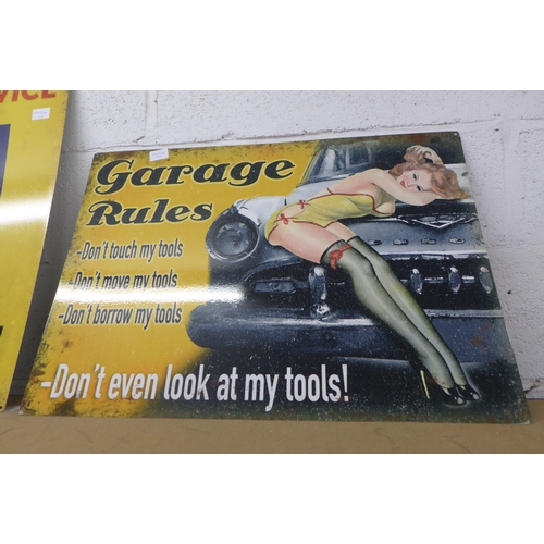 2099 - A Garage Rules sign