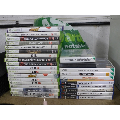 2106 - An Xbox 360 console with assorted games and various attachments