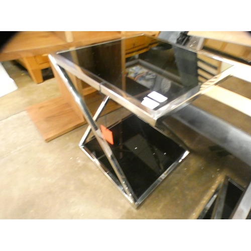 1316 - A black glass and chrome lamp table * this lot is subject to VAT