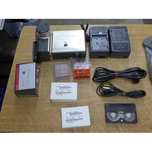 2128 - A Sharp VL-E97 Viewcam video camera with charger and other accessories