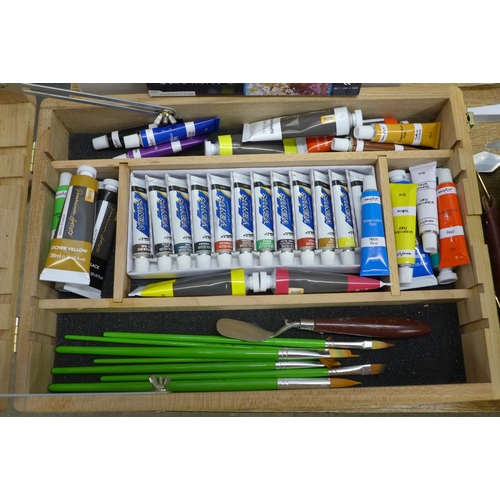 2132 - A box of assorted art supplies including canvasses brushes paints and painting books including bob r... 