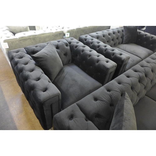 1304 - A Fenzi black buttoned velvet three seater sofa, two seater sofa and armchair * This lot is subject ... 