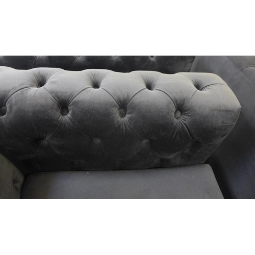 1304 - A Fenzi black buttoned velvet three seater sofa, two seater sofa and armchair * This lot is subject ... 