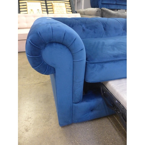 1491 - A blue velvet Chesterfield metal action sofa bed