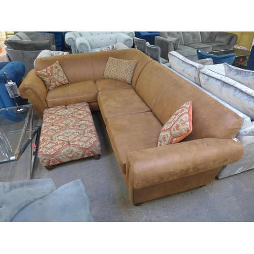 1496 - A tan vegan leather corner sofa and contrasting Aztec patterned footstool and scatter cushions