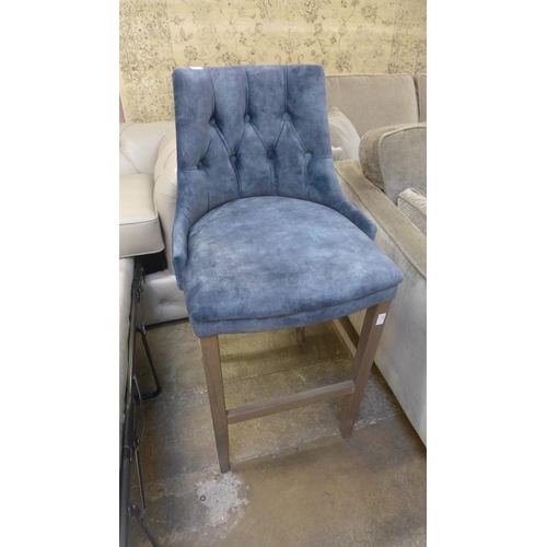 1500 - A blue upholstered buttoned bar stool