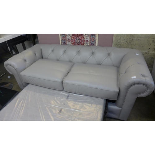 1503 - A stone leather Chesterfield metal action sofa bed