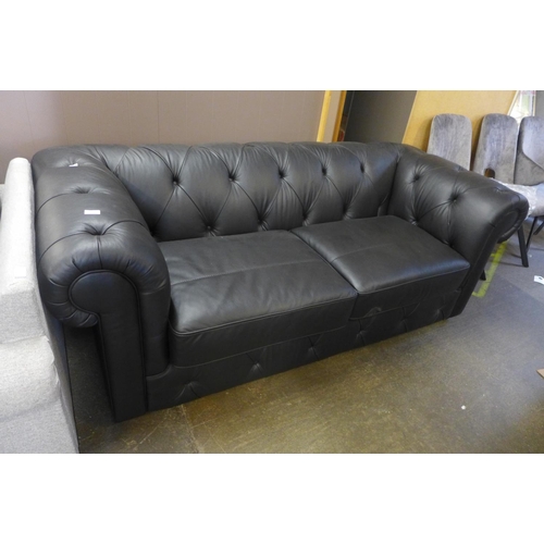 1508 - A black leather Chesterfield three seater sofa