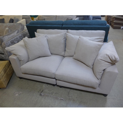 1517 - An extra deep taupe upholstered two seater sofa